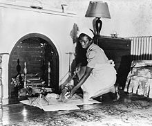 Maid cleaning fireplace fsa 8e04227.jpg